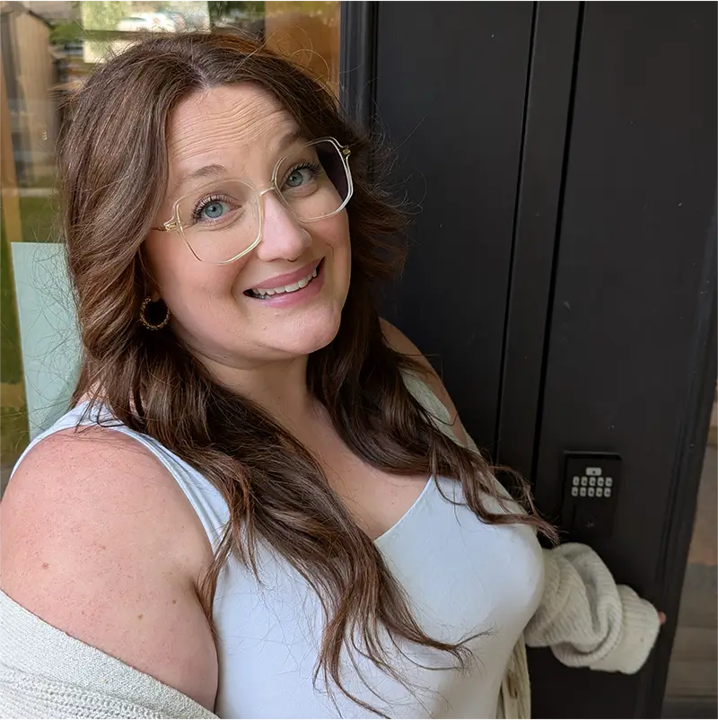 Danics smiling in front of the TVS studio doors.
