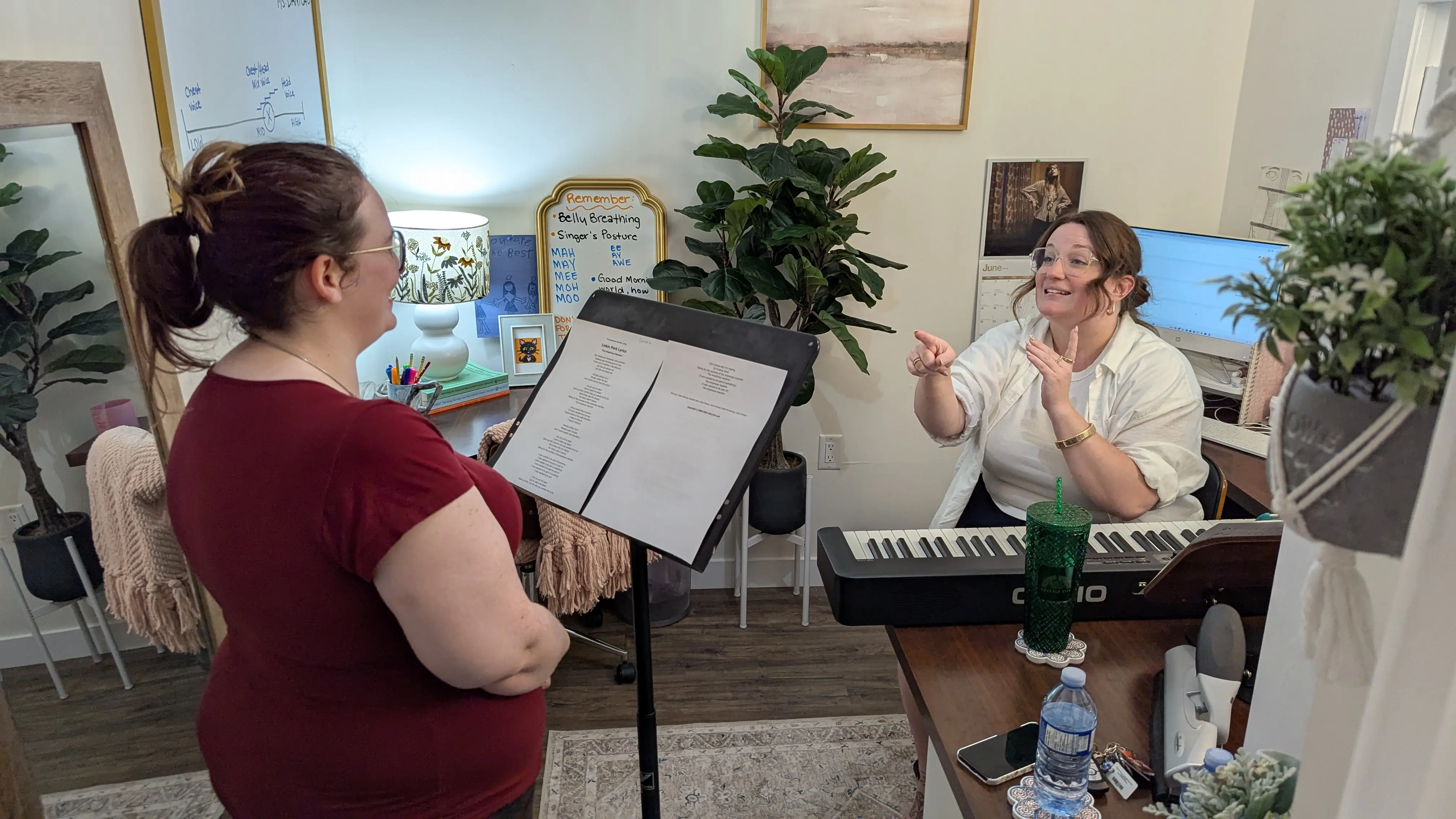 Danica instructing a student in the studio.